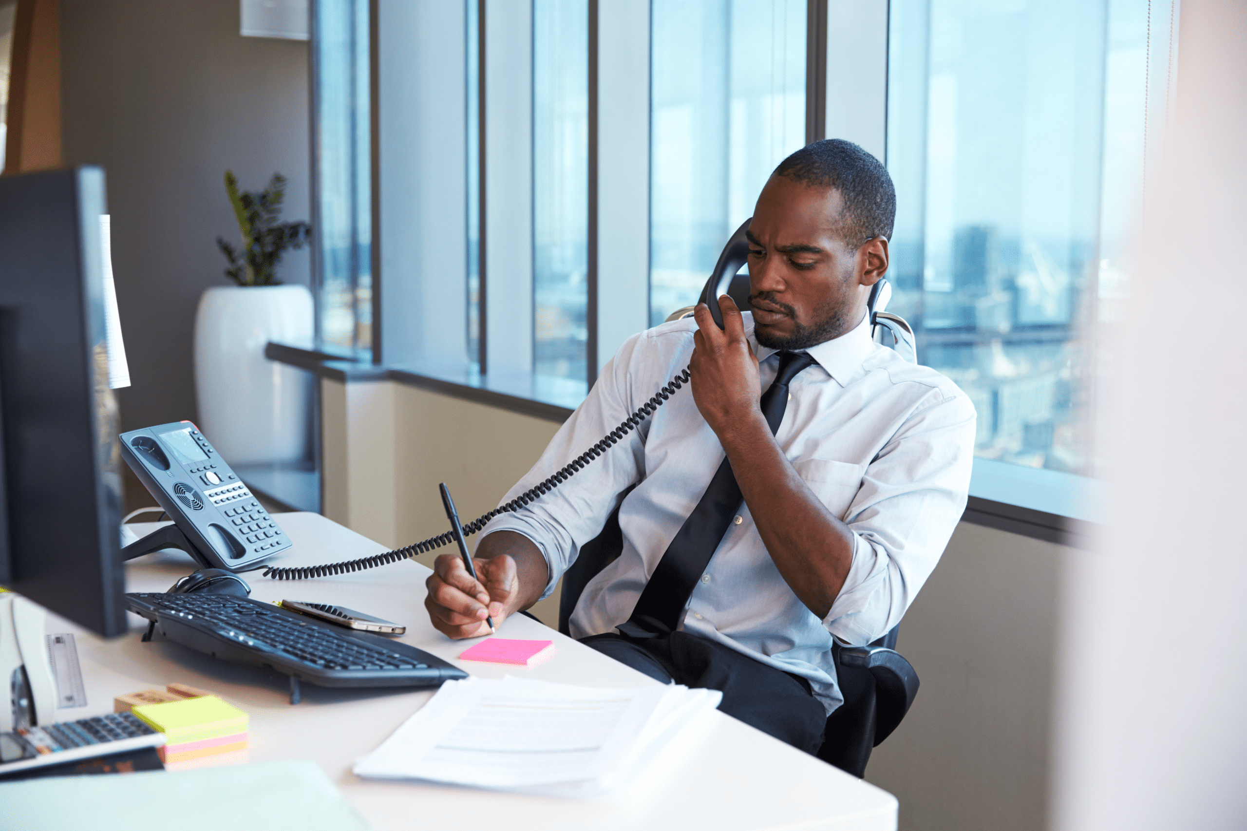 Man talking on VoIP phone